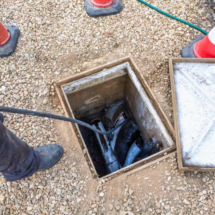 A drain engineer unblocked a blocked drain